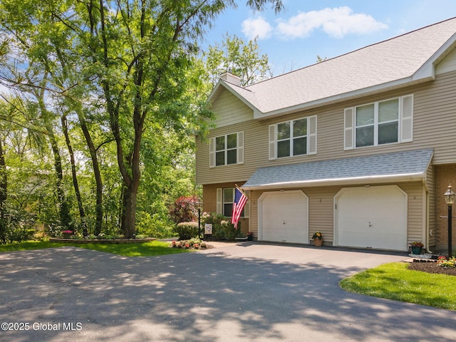1401 Balltown Rd, Niskayuna, NY 12309 - view of front of property featuring asphalt driveway, a chimney, roof with shingles, and an attached garage