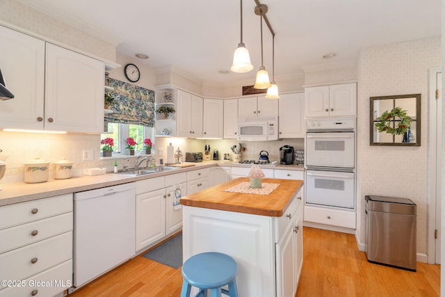 1401 Balltown Rd, Niskayuna, NY 12309 - kitchen featuring white appliances, a sink, butcher block countertops, light wood-type flooring, and white cabinets