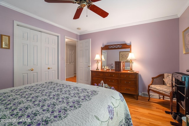 1401 Balltown Rd, Niskayuna, NY 12309 - bedroom featuring light wood-type flooring, crown molding, a closet, baseboards, and a ceiling fan
