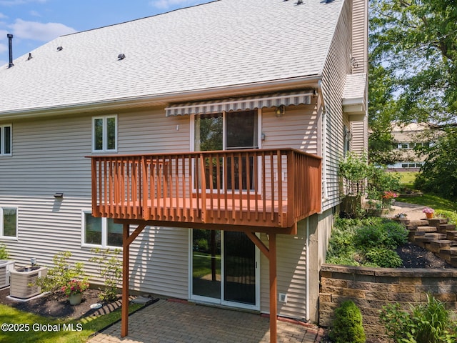 1401 Balltown Rd, Niskayuna, NY 12309 - rear view of house featuring a deck, central AC unit, a patio, and a shingled roof