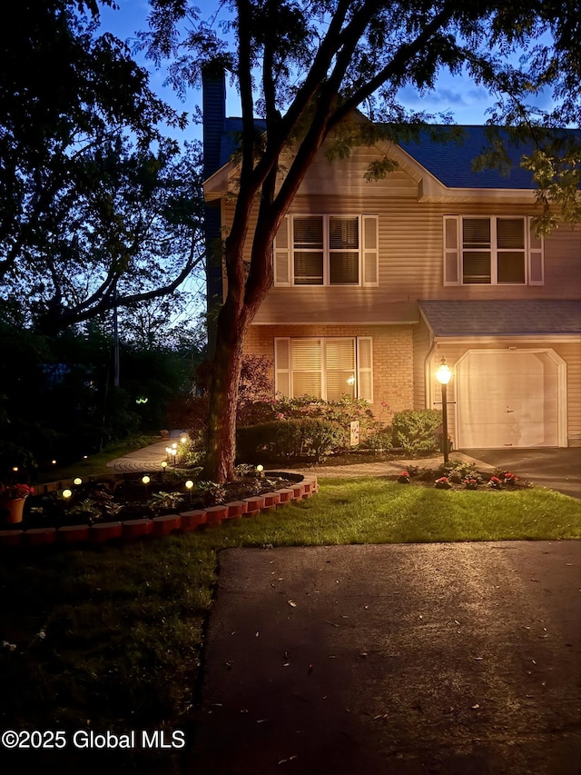 1401 Balltown Rd, Niskayuna, NY 12309 - view of front of house with a chimney, an attached garage, driveway, and brick siding
