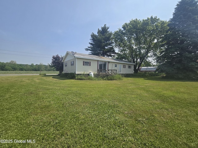 1056 Carlisle Rd, Root, NY 13317 - manufactured / mobile home featuring a front lawn