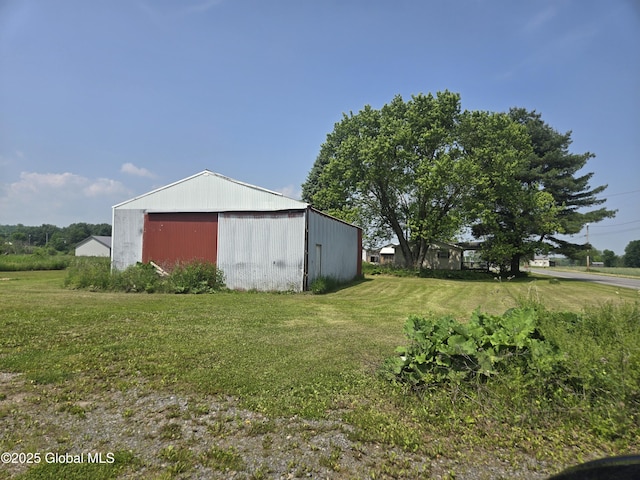 1056 Carlisle Rd, Root, NY 13317 - view of grassy yard with an outbuilding and a detached garage