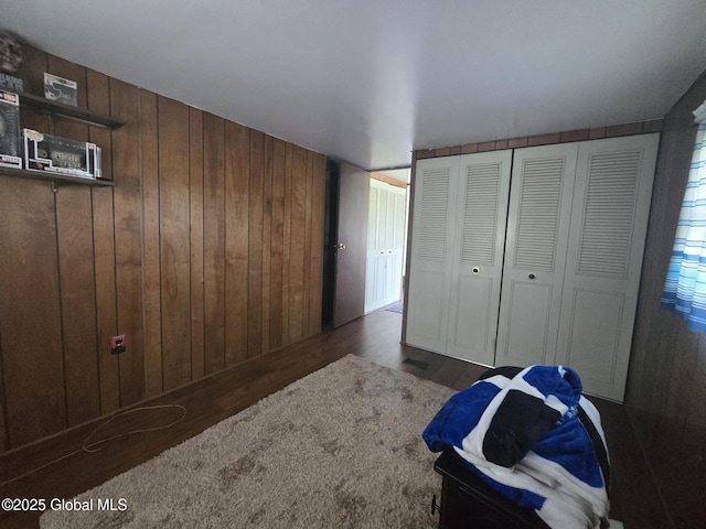 1056 Carlisle Rd, Root, NY 13317 - unfurnished bedroom with wood walls and wood finished floors