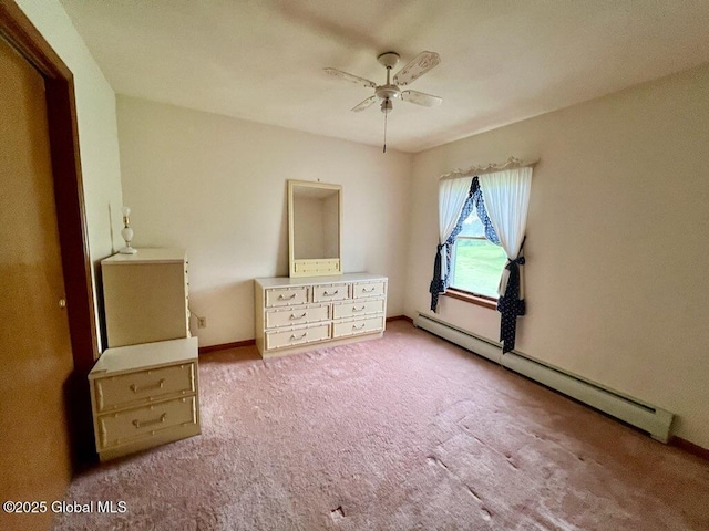 19 Cartier Ln, Fort Ann, NY 12827 - unfurnished bedroom featuring a baseboard heating unit, carpet floors, and ceiling fan