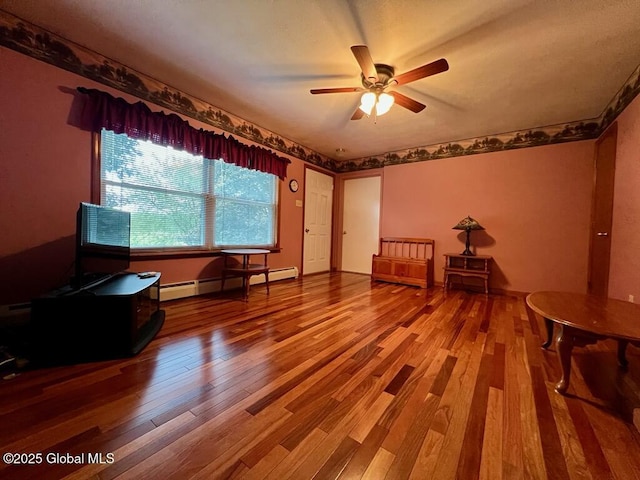 19 Cartier Ln, Fort Ann, NY 12827 - sitting room featuring wood finished floors, a ceiling fan, and baseboard heating