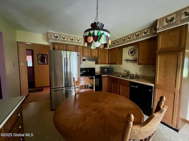 19 Cartier Ln, Fort Ann, NY 12827 - kitchen featuring black appliances, under cabinet range hood, light countertops, and brown cabinetry