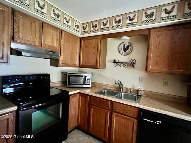 19 Cartier Ln, Fort Ann, NY 12827 - kitchen with black appliances, under cabinet range hood, brown cabinets, and light countertops