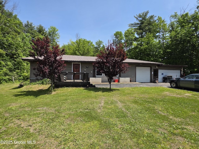 3841 State Highway 30, Mayfield, NY 12010 - view of front of house featuring a front yard, a garage, and asphalt driveway
