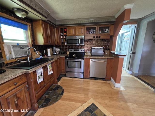 3841 State Highway 30, Mayfield, NY 12010 - kitchen with appliances with stainless steel finishes, open shelves, a textured ceiling, crown molding, and decorative backsplash