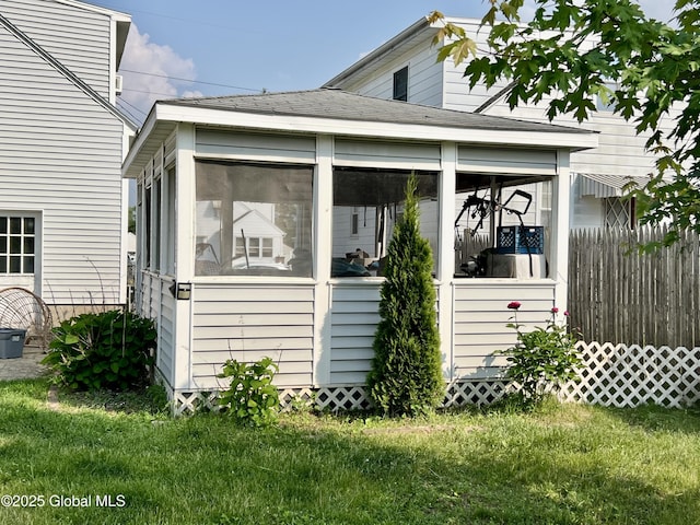 2803 Wellington Ave, Rotterdam, NY 12306 - view of property exterior with a sunroom, a yard, and a shingled roof