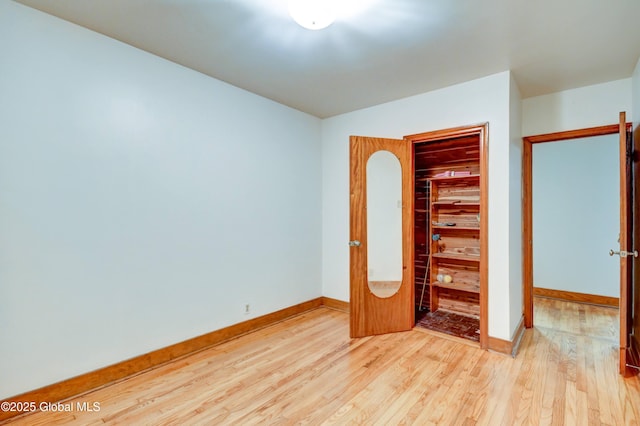 55 Crescent Ave, Amsterdam, NY 12010 - unfurnished bedroom with wood finished floors, baseboards, and a closet