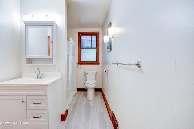 55 Crescent Ave, Amsterdam, NY 12010 - full bath with vanity, wood finished floors, toilet, and a shower with shower curtain