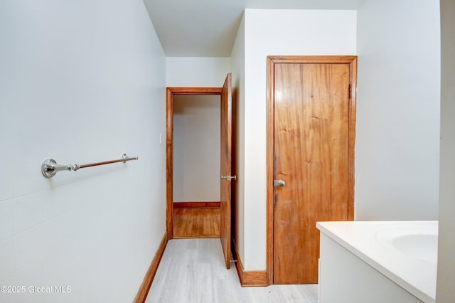 55 Crescent Ave, Amsterdam, NY 12010 - bathroom featuring wood finished floors, vanity, and baseboards
