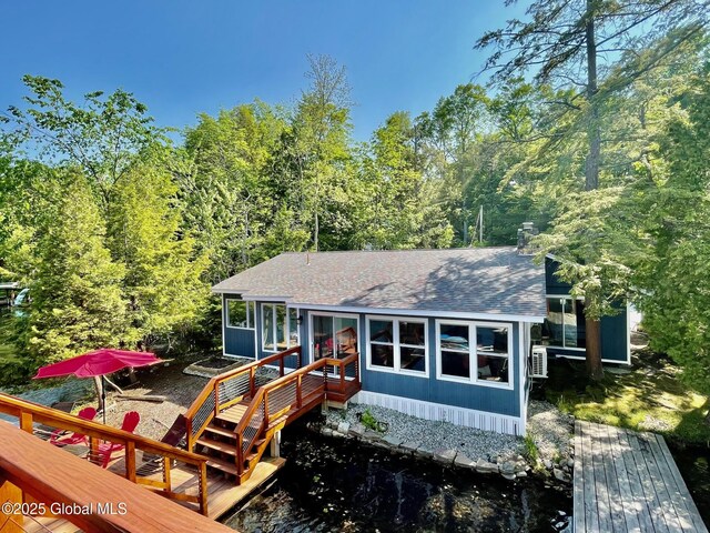 3602 Echo Bay Ln, Fort Ann, NY 12844 - view of front of house featuring a shingled roof and a wooded view