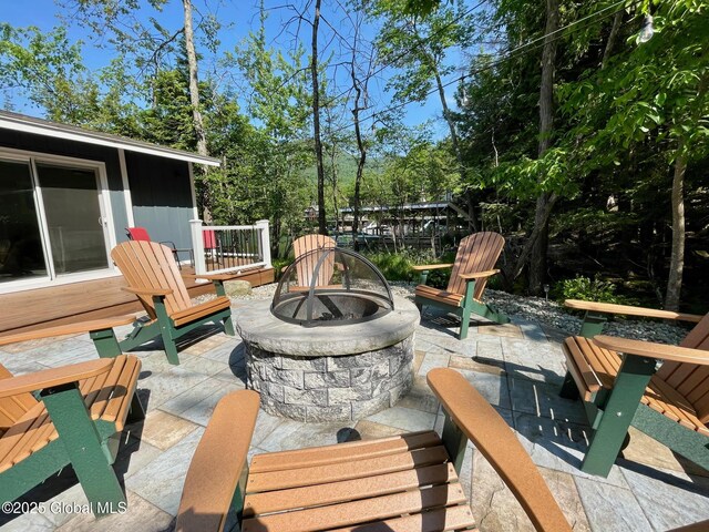 3602 Echo Bay Ln, Fort Ann, NY 12844 - deck featuring an outdoor fire pit and a patio area