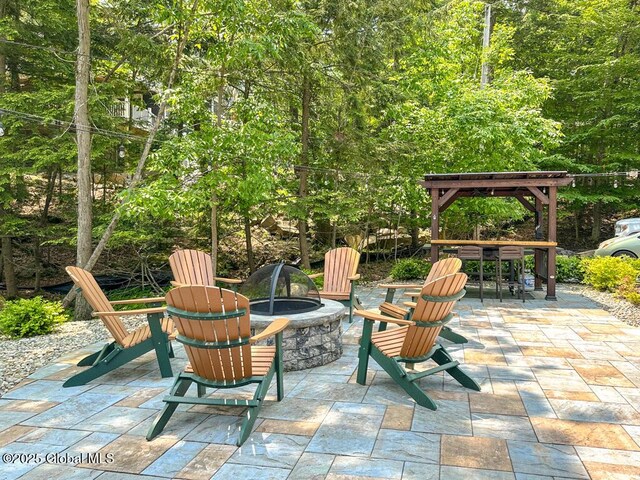 3602 Echo Bay Ln, Fort Ann, NY 12844 - view of patio featuring a fire pit