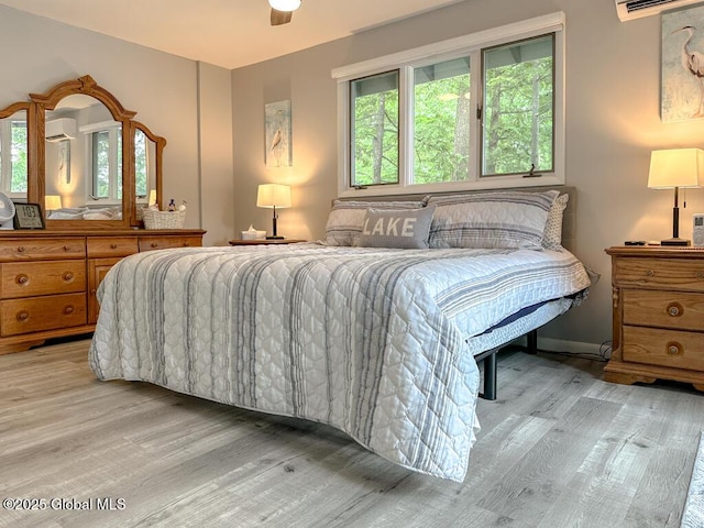 3602 Echo Bay Ln, Fort Ann, NY 12844 - bedroom with light wood-type flooring, multiple windows, and a wall mounted AC