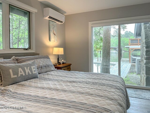 3602 Echo Bay Ln, Fort Ann, NY 12844 - bedroom featuring an AC wall unit and access to outside