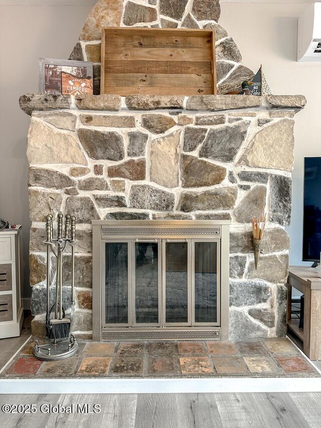3602 Echo Bay Ln, Fort Ann, NY 12844 - detailed view of an AC wall unit and a stone fireplace