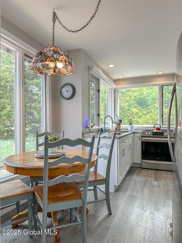 3602 Echo Bay Ln, Fort Ann, NY 12844 - dining room with light wood-style floors, plenty of natural light, and recessed lighting