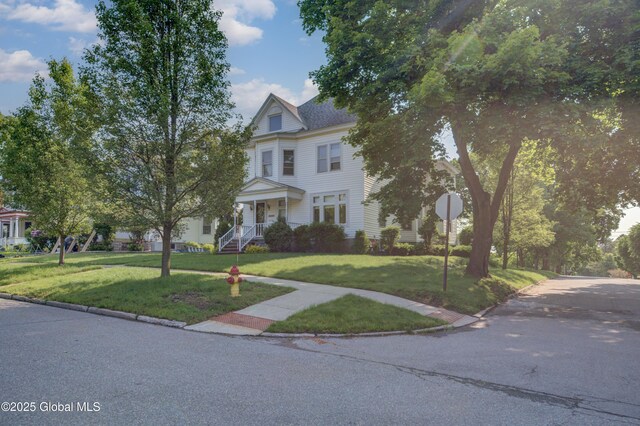 510 S William St, Johnstown, NY 12095 - victorian-style house featuring a front lawn