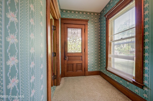 510 S William St, Johnstown, NY 12095 - doorway with wallpapered walls, carpet flooring, and healthy amount of natural light