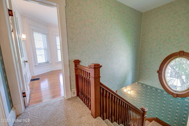 510 S William St, Johnstown, NY 12095 - stairway with wallpapered walls and wood finished floors
