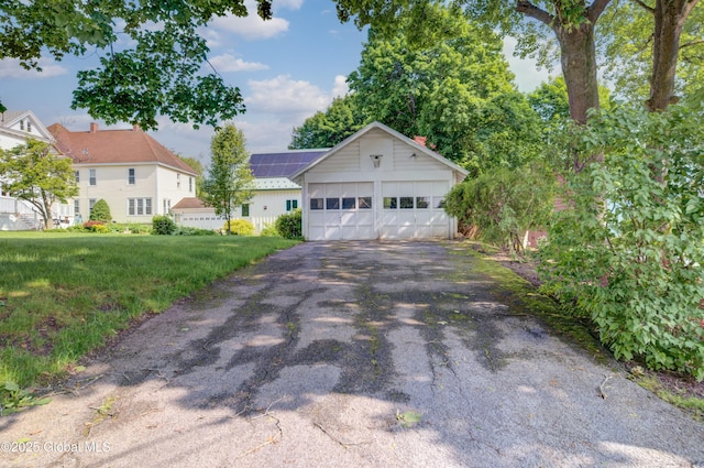 510 S William St, Johnstown, NY 12095 - ranch-style house with a garage, a front lawn, and board and batten siding