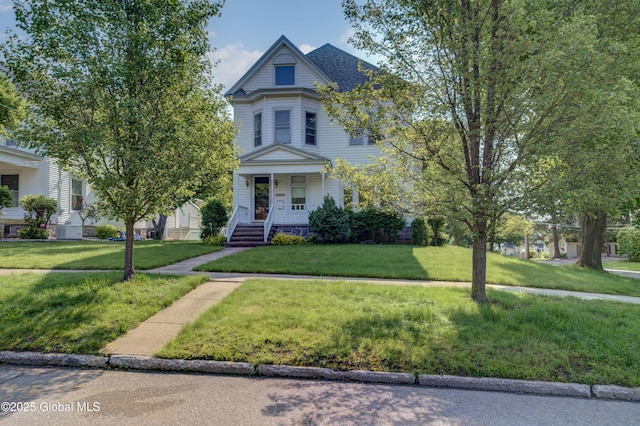 510 S William St, Johnstown, NY 12095 - victorian-style house featuring a porch and a front yard