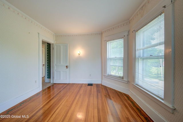 510 S William St, Johnstown, NY 12095 - spare room featuring light wood finished floors and crown molding
