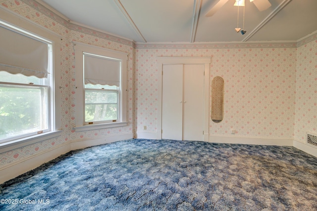 510 S William St, Johnstown, NY 12095 - spare room featuring carpet flooring, wallpapered walls, and a ceiling fan