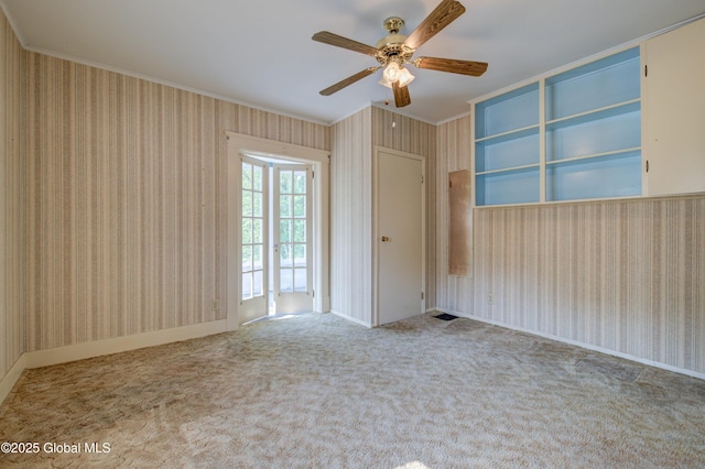 510 S William St, Johnstown, NY 12095 - unfurnished room with ornamental molding, wallpapered walls, ceiling fan, and carpet