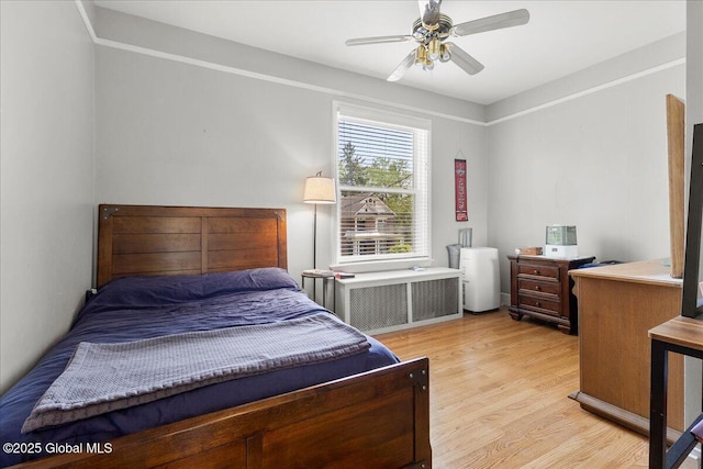 4 Van Dyke Ave, Amsterdam, NY 12010 - bedroom featuring light wood-type flooring, radiator heating unit, and ceiling fan