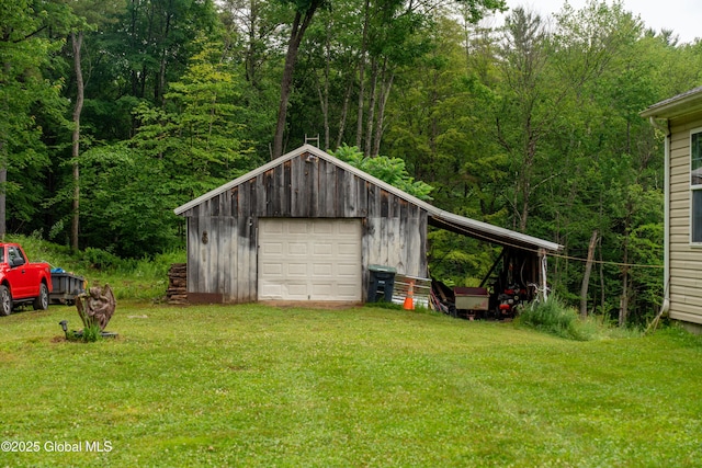 79 Chandler Ln, Greenfield, NY 12859 - view of outdoor structure with driveway and a wooded view