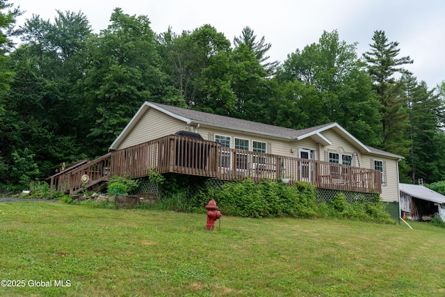 79 Chandler Ln, Greenfield, NY 12859 - view of front facade with a front lawn and a wooden deck