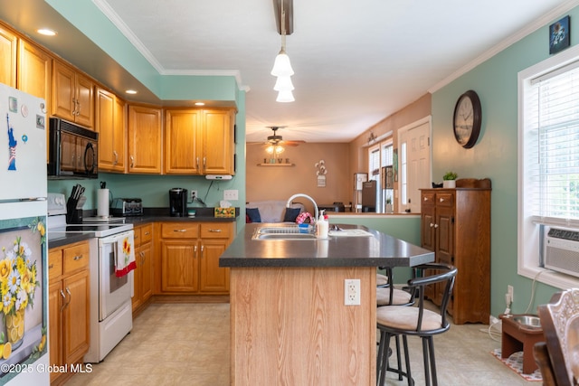 79 Chandler Ln, Greenfield, NY 12859 - kitchen featuring white appliances, dark countertops, a center island with sink, a breakfast bar, and ceiling fan
