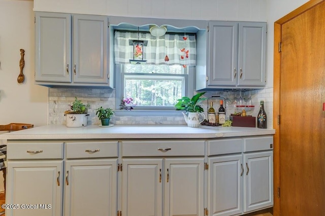 8 Birchtree Ln, Milton, NY 12020 - kitchen featuring backsplash, gray cabinets, and light countertops
