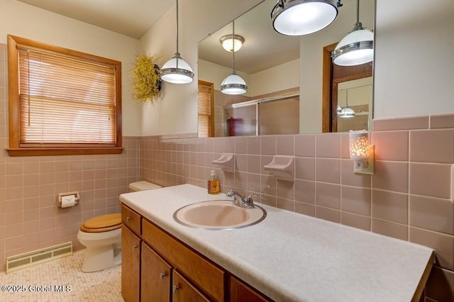 8 Birchtree Ln, Milton, NY 12020 - full bathroom featuring tile walls, vanity, toilet, a shower with shower door, and tile patterned flooring