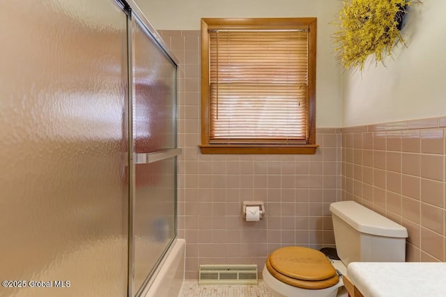 8 Birchtree Ln, Milton, NY 12020 - full bath with toilet, tile walls, shower / bath combination with glass door, and vanity