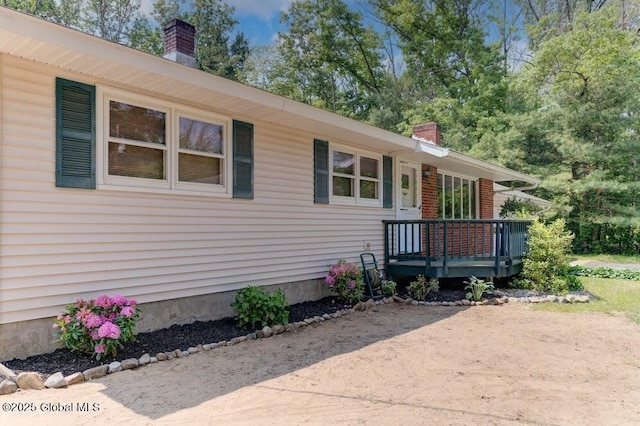 8 Birchtree Ln, Milton, NY 12020 - view of front of property featuring a chimney and a wooden deck