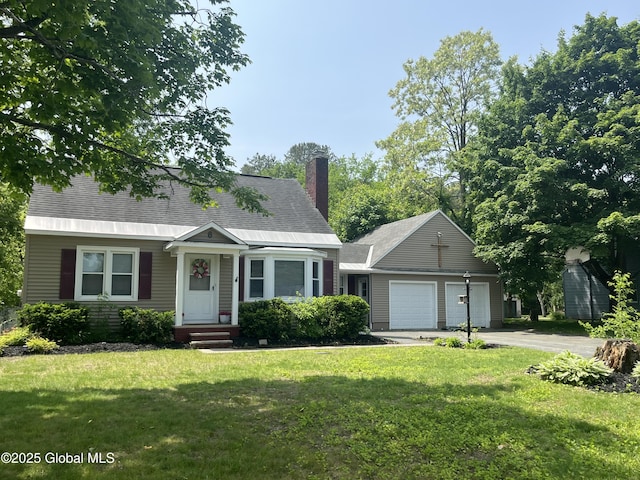 6 Pine Rd, Moreau, NY 12803 - view of front facade featuring driveway, a front lawn, a chimney, and an attached garage
