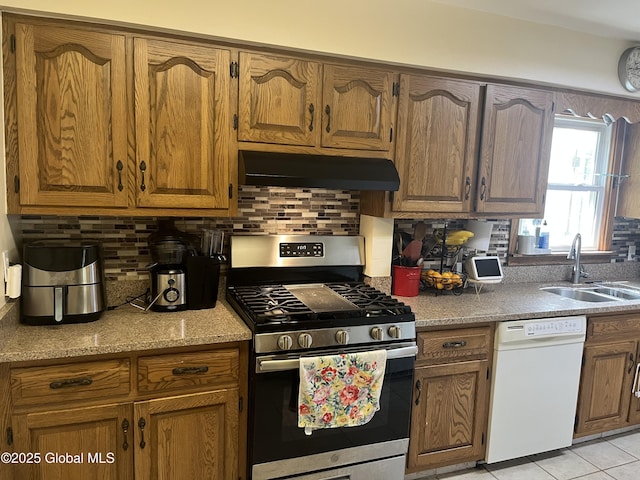 6 Pine Rd, Moreau, NY 12803 - kitchen with gas range, dishwasher, under cabinet range hood, a sink, and tasteful backsplash