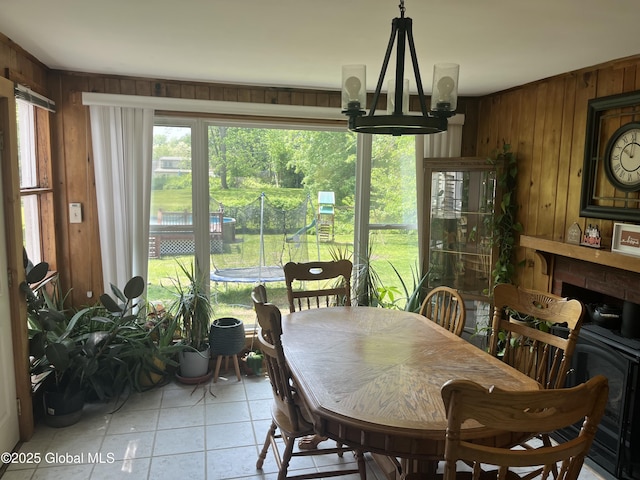 6 Pine Rd, Moreau, NY 12803 - dining room with wooden walls, light tile patterned floors, and plenty of natural light