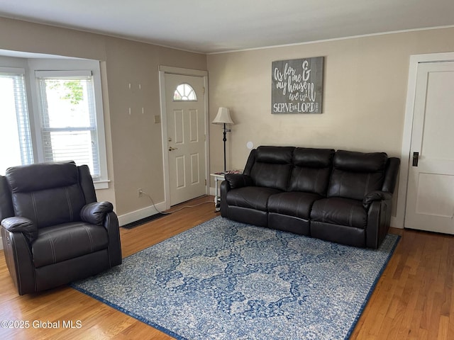 6 Pine Rd, Moreau, NY 12803 - living area with healthy amount of natural light, wood finished floors, and crown molding
