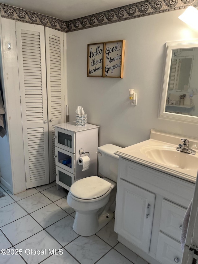 6 Pine Rd, Moreau, NY 12803 - bathroom with marble finish flooring, toilet, vanity, and a closet