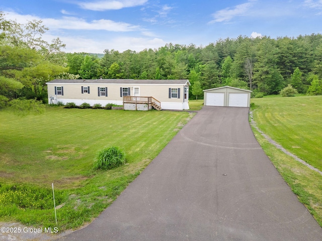 131 Abrams Rd, Wright, NY 12023 - manufactured / mobile home with a detached garage, an outdoor structure, a wooden deck, and a front lawn