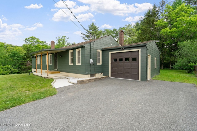 16 Smith Ln, East Greenbush, NY 12144 - single story home with a chimney, a garage, a front yard, and driveway