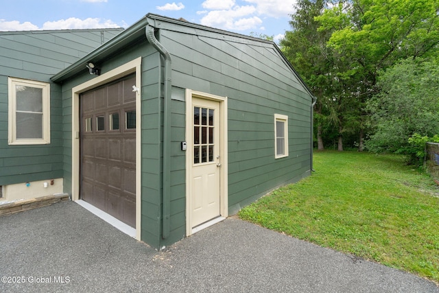 16 Smith Ln, East Greenbush, NY 12144 - garage featuring asphalt driveway