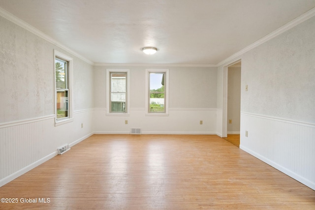 16 Smith Ln, East Greenbush, NY 12144 - unfurnished room with light wood-type flooring, ornamental molding, and wainscoting